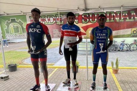 Deeraj Garbarran from Kaieteur Attack Racing, led countrymen Kemuel Moses (right) of Team Alanis and Team Evolution’s Christopher Griffith across the finish line on Sunday as the Guyanese riders dominated their Dutch speaking rivals on their home turf.
