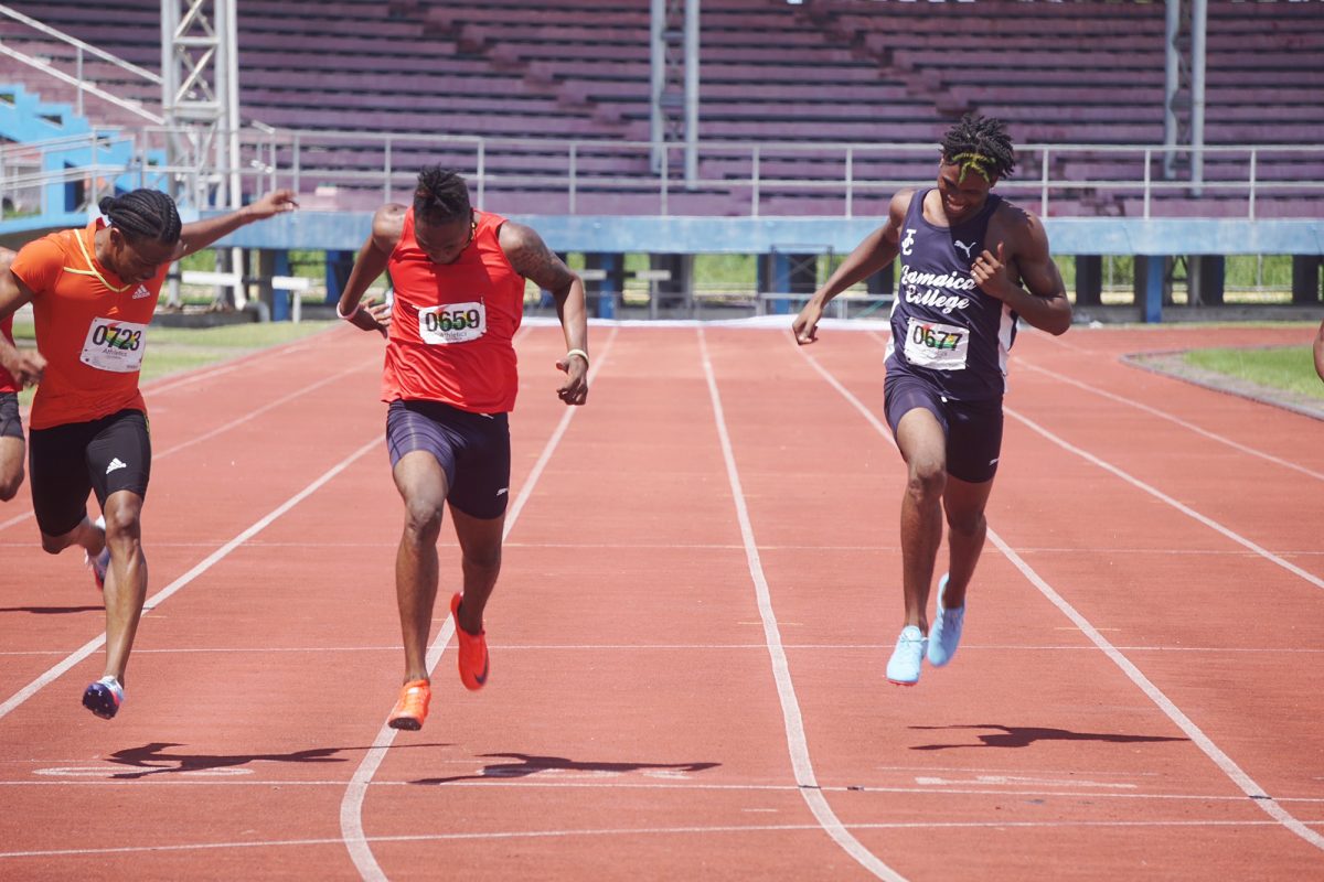 Dead Heat! Loneil Marks (centre) won the men’s 200m with a time of in an exciting photo finish with Noelex Holder (left) and Revon Williams (right). (Emmerson Campbell photo)