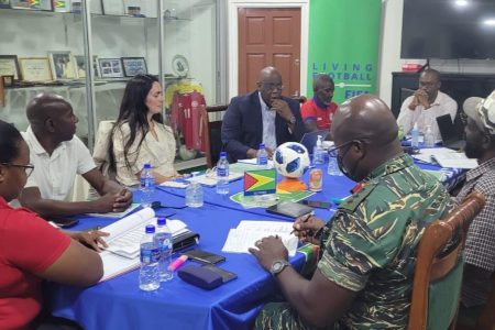FIFA Member Association Manager Sofia Malizia (3rd from left) and One Concacaf Manager Howard McIntosh (4th from left) during a consultation meeting with several members of the GFF Executive and General Council