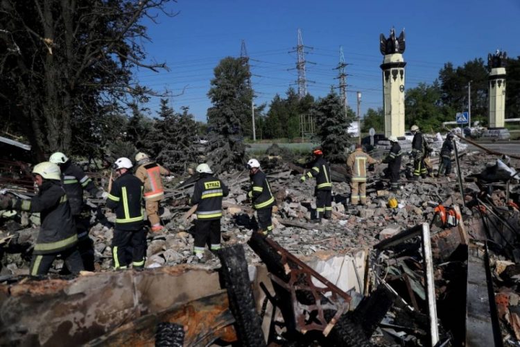 Firefighters remove debris searching a casualty following a military strike, as Russia's attack on Ukraine continues, in Kharkiv, Ukraine June 9, 2022. ― Reuters pic