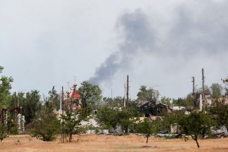 Smoke rises above a church and residential buildings in the course of Ukraine-Russia conflict in the town of Rubizhne in the Luhansk region, Ukraine June 1, 2022. REUTERS/Alexander Ermochenko