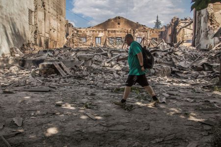 A local resident walks in a front of a building destroyed by a military strike, as Russia's attack on Ukraine continues, in Lysychansk, Luhansk region, Ukraine June 17, 2022. REUTERS/Oleksandr Ratushniak