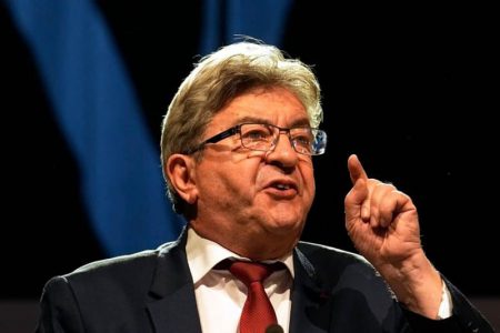 Hard-left leader Jean-Luc Mélenchon delivers in Paris on Sunday after initial results showed gains for his parliamentary bloc. (Michel Euler/The Associated Press) 