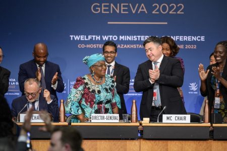 epa10017500 World Trade Organization Director-General Ngozi Okonjo-Iweala (C-L) applauds next to conference chair Timur Suleimenov (2-R) after a closing session of a World Trade Organization Ministerial Conference at the WTO headquarters in Geneva, Switzerland, early 17 June 2022. The WTO concluded deals on tackling food insecurity, curbing harmful fishing subsidies and temporarily waiving Covid-19 vaccine patents after days of round-the-clock talks.  EPA-EFE/Fabrice Coffrini / POOL
