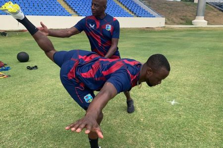 Fit-again seamer Kemar Roach does some stretches ahead of today’s first tst (Photo courtesy CWI Media) 
