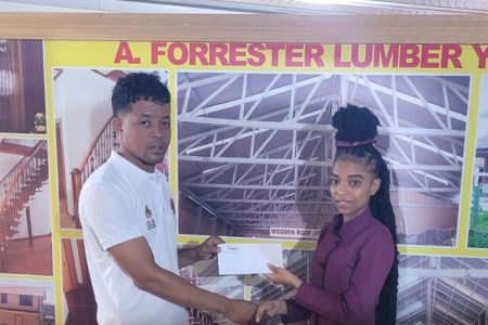 Slingerz FC member Kacey Pearson (left) receives the club’s support from Forrester’s Lumber and Building Complex representative DeAndrea Yansen