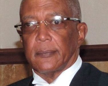 Retired Justice Stanley John