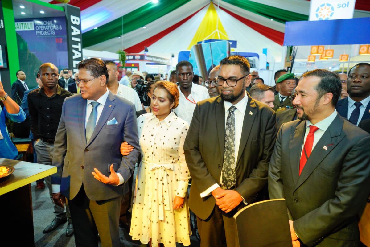 President Irfaan Ali yesterday spoke at the Suriname Energy Oil and Gas Summit in Paramaribo. According to a release from the Office of the President, Ali said that the region has the potential to not only become energy secure but to become an energy player on the global stage. The President also visited the oil and gas exhibition, where he interacted with representatives from a number of companies. 
In this Office of the President photo, President Irfaan Ali (is second from right) with (from left) Suriname’s President Chandrikapersad Santokhi, Surinamese First Lady Mellisa Santokhi-Seenacherry and Trinidad’s Minister of Energy and Energy Industries, Stuart Young. (Office of the President photo)
