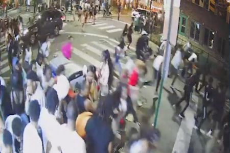 A screen grab from a surveillance video from the shooting shows people on a crowded street running in panic, presumably after gun shots were fired, in Philadelphia, Pennsylvania, U.S., June 4, 2022. South Street CCTV/Handout via REUTERS