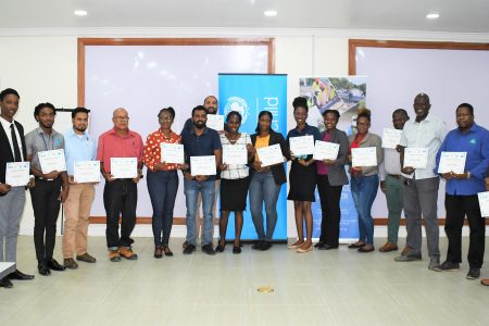Participants with their certificates at the end of the training at the Civil Defence Commission headquarters, Georgetown. 
