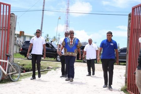 Prime Minister Mark Phillips (centre) heading to the outreach.