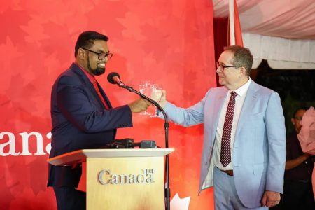 President Irfaan Ali sharing a toast with Canadian High Commissioner Mark Berman 