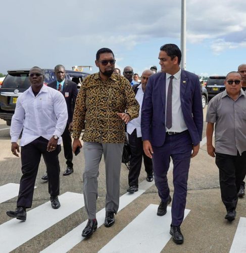 President Irfaan Ali (second from left) after arriving in Suriname today. (Office of the President photo)