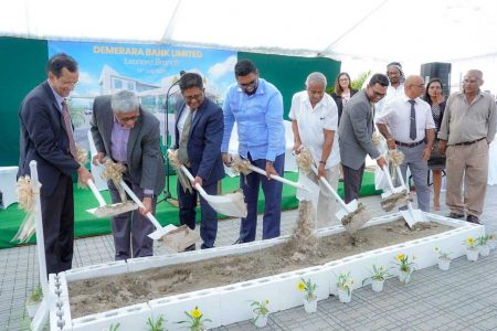 President Irfaan Ali (fourth from left) along with Finance Minister Ashni Singh (third from left), Chairman of the Board of Directors of Demerara Bank, Komal Samaroo (second from left), CEO Pravinchandra Dave (left) and other officials turning the sod for the construction of the new branch of the bank (Office of the President photo) 