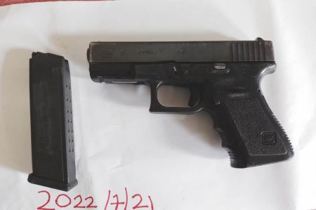 The pistol and empty magazine that were found by police  (Guyana Police Force photo)
