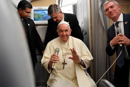 Pope Francis holds a news conference aboard the papal plane on his flight back after visiting Canada, July 29, 2022. (Divisione Produzione Fotografica/Handout via Reuters) 
