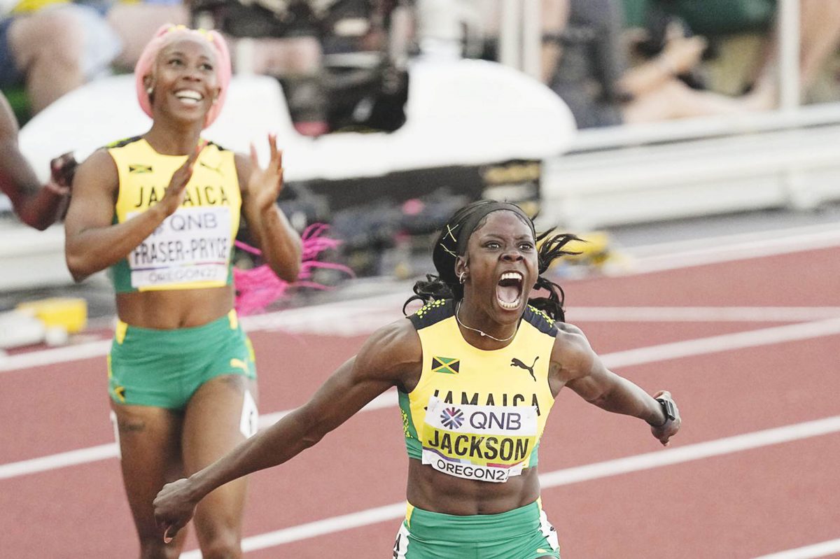 Shericka Jackson storming to gold in the Women’s 200m at the World Athletics Championship. In the background is compatriot and silver medalist Shelly-Ann Fraser-Pryce