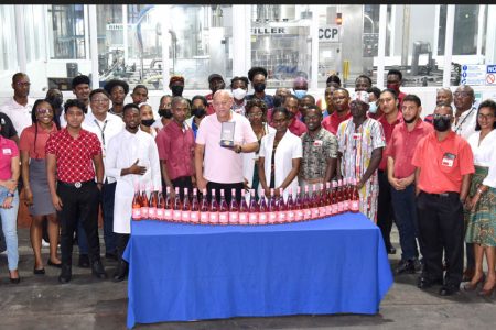 Employees of the Rum Factory/Winery and Quality Assurance Departments
celebrate the success of the Monde Selection Quality Awards.  (Banks DIH photo)
