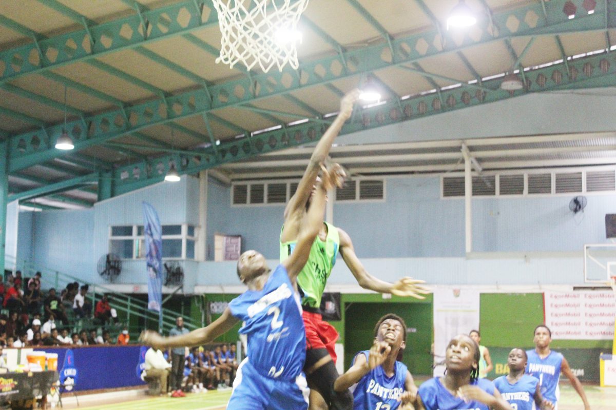 Scenes from the Chase Academy (green) and Mackenzie High clash in the ExxonMobil NSBF at the Cliff Anderson Sports Hall
