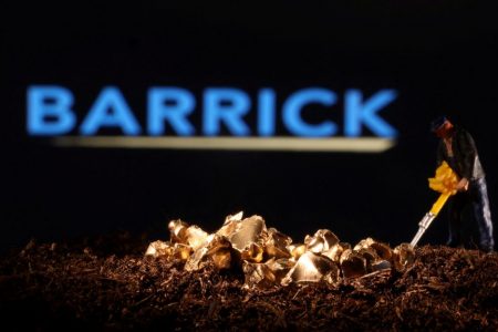 A small toy figure and gold imitation are seen in front of the Barrick logo in this illustration taken November 19, 2021. REUTERS/Dado Ruvic/Illustration/File Photo