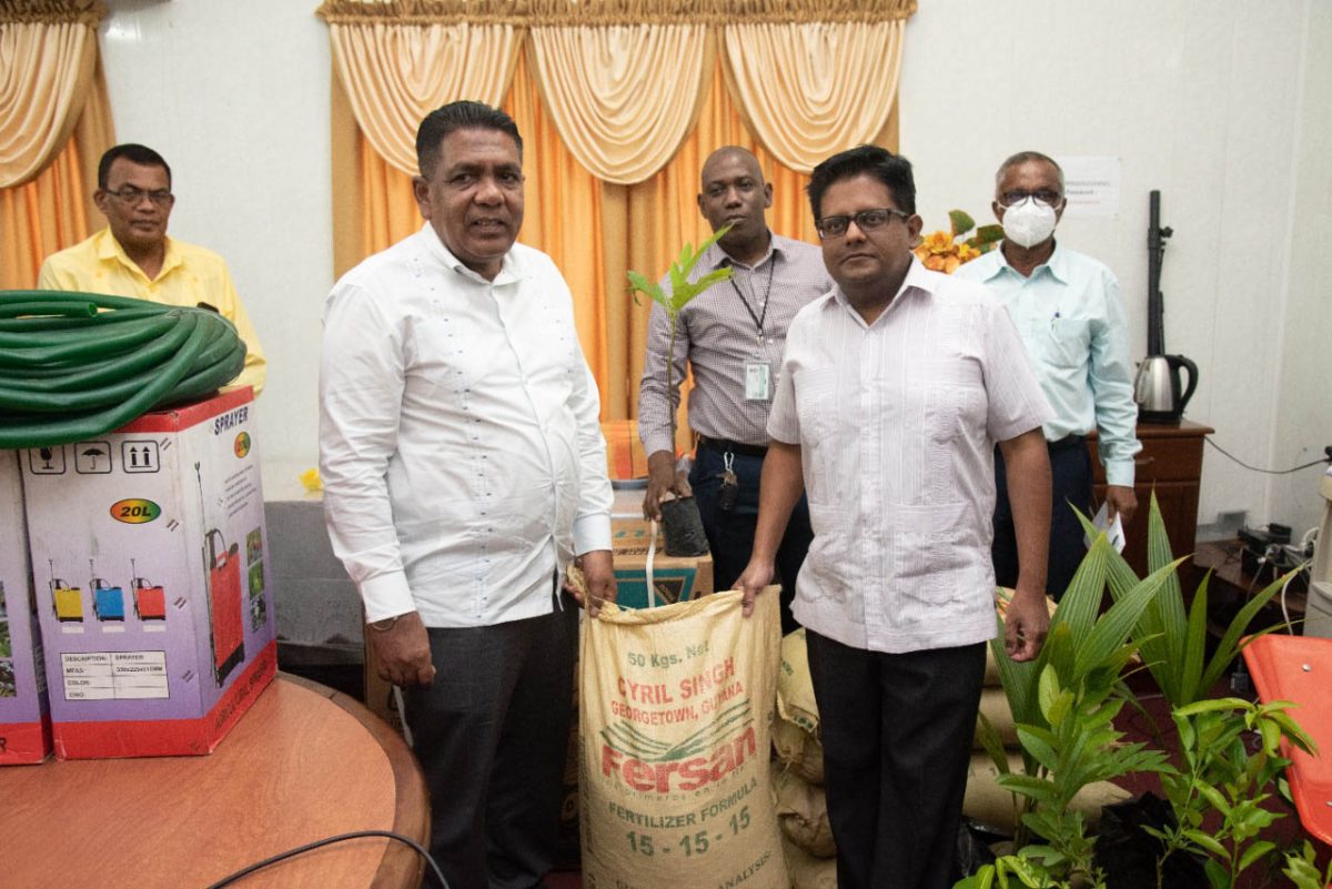 In the foreground are Ministers Ashni Singh (right) and Zulfikar  Mustapha (Ministry of Finance photo)