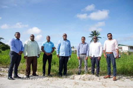 Prime Minister Mark Phillips (centre) with other officials at the site