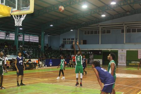 Scenes from the Bishops’ High (green) and Christ Church clash in the National School Basketball Festival yesterday at the Cliff Anderson Sports Hall, Homestretch Avenue.