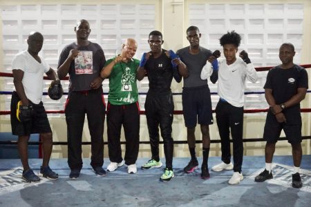 Under the watchful eyes of coaches, Lennox Daniels, Terrence Poole, Francisco Roldan and Sebert Blake, the prized trio were sparring and working on other facets of their craft. Here they took some time out to pose for a photo for this daily. (Emmerson Campbell photo)