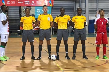 Guyanese referees Colin Abel (2nd from right) and Lenval Peart (1st from right) prior to the start of the Futsal final at the inaugural Caribbean Games.