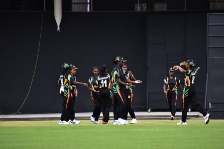 Guyana under-19 girls celebrate a wicket during their 10-wicket win against the Leeward Islands yesterday in Trinidad.