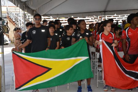 Captain of Team Guyana Shomari Wiltshire leading the contingent at the official opening of the 2022 Junior CASA.