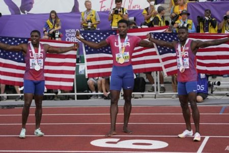 Gold medallist Fred Kerley (centre) stands with silver medallist Marvin Bracy (right) and bronze medallist Trayvon Bromell after the final of the men's 100m at the World Athletics Championships in Eugene, Oregon, on Jul 16, 2022. (Photo: AP/David J Phillip)