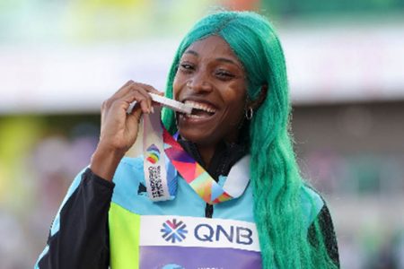 Bahamian Shaunae Miller-Uibo celebrates her first-ever World Championships 400m gold.