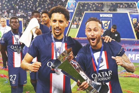 Paris St Germain’s Marquinhos and Neymar celebrate winning the Trophee des Champions with the trophy REUTERS/Ronen Zvulun