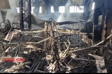 A still picture from video released by Russian war correspondent Andrei Rudenko showing the burned-out remains of what he said was the prison where 40 POws were killed and 75 wounded on 29 July 2022 in a missile attack. [Twitter]