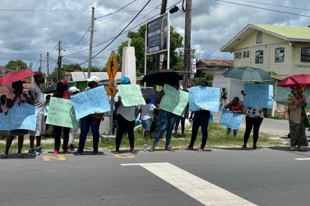 Some of the protesters on the picket line at Buxton, East Coast Demerara