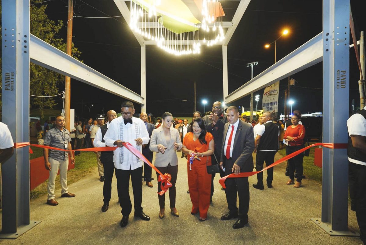 First Lady Arya Ali is joined by President Irfaan Ali (first, at left) ministers of Housing and Water Susan Rodrigues and Collin Croal, and CEO of Central Housing and Planning Authority Sherwyn Greaves as she cuts the ceremonial ribbon to declare the International Building Expo open (Office of the President Photo) 