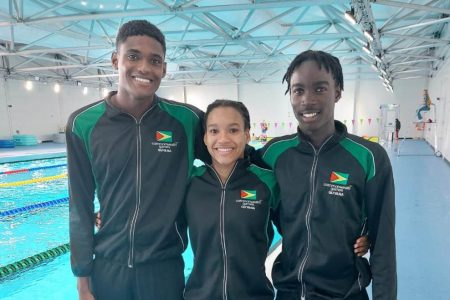 Paul Mahaica Jr, Aleka Persaud and Shekel Tzedeq following their competition on the opening day for Swimming at the Commonwealth Games. 