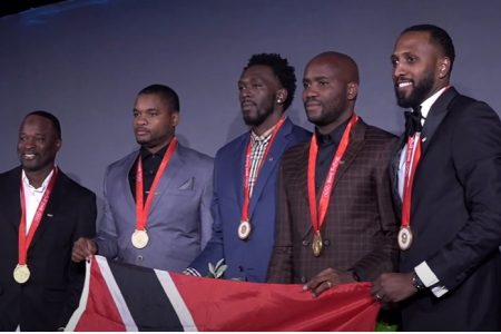 The Trinidad and Tobago 4x100metre relay team members display their gold medals.
