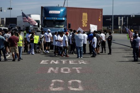 Independent truck drivers gather to delay the entry of trucks at a container terminal at the Port of Oakland, during a protest against California's law known as AB5, in Oakland, California, July 18, 2022. REUTERS/Carlos Barria