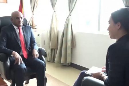 Vice-President Bharrat Jagdeo (left) being interviewed by VICE Media journalist Isobel Yeung