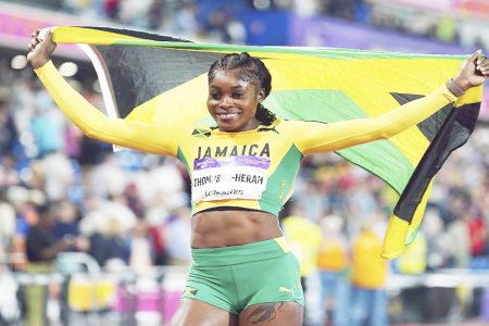 Jamaica's Elaine Thompson-Herah celebrates after winning the Women's 100m final, in the Alexander Stadium at the Commonwealth Games in Birmingham, England, Wednesday, Aug. 3, 2022. (Mike Egerton/PA via AP)