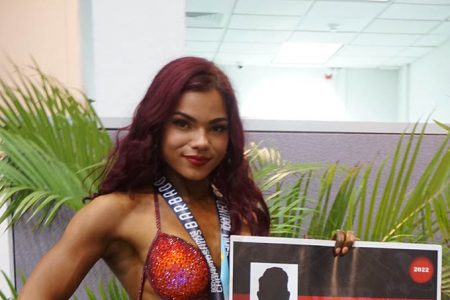 IFBB Elite Pro, Rosanna Fung poses with her spoils in Barbados after earning pro status at this year’s CAC Bodybuilding and Fitness Championship. (Emmerson Campbell photo)
