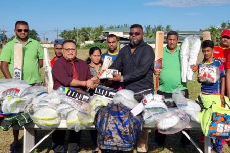 GCB President Bissoondyal Singh (left) hands over gear donation to EBCA’s President Puneet Jaigopaul