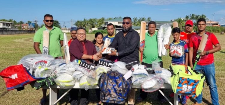 GCB President Bissoondyal Singh (left) hands over gear donation to EBCA’s President Puneet Jaigopaul