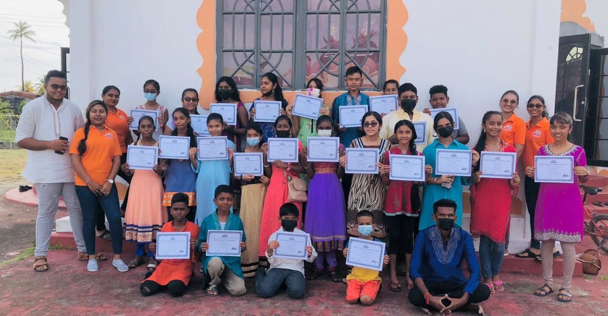 Youths posing with their certificates of participation