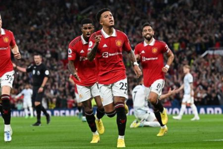 Jaden Sancho (centre) of Manchester United celebrating after scoring his team’s opening goal against Liverpool