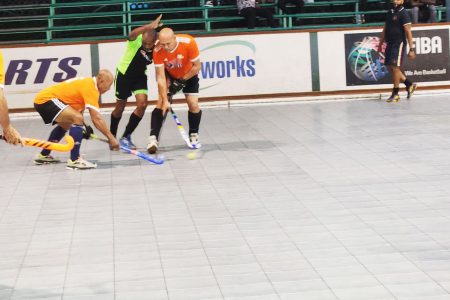 A scene from the Lucozade Indoor Hockey Championship at the Cliff Anderson Sports Hall between Hikers Cadets (green) and GCC the Sequel