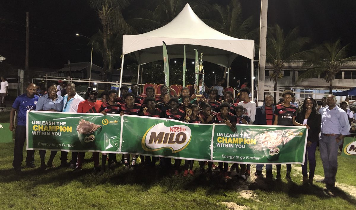 Dynasty! Defending champion Christianburg/Wismar posing with the winner’s trophy after successfully retaining the Milo Secondary School Football Championship