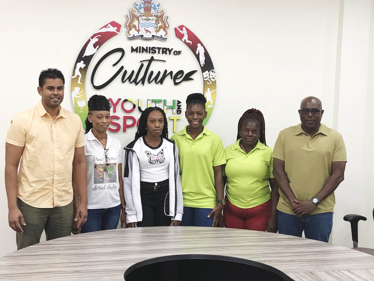 Dream realised! Minister of Culture, Youth and Sport Charles Ramson Jr (1st from left), and Director of Sport (1st from right) posing alongside national and scholarship awardees and national athletes, Adriel Austin (3rd from left) and Anisha Gibbons (3rd from right). Also in the photo is Linda Johnny, mother of Gibbons (2nd from right) and Austin’s mother Joylyn Beaton
